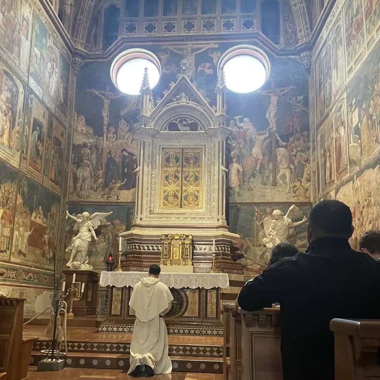 Rev. Simon Teller, O.P. praying in the chapel of the miraculous corporal in Orvieto