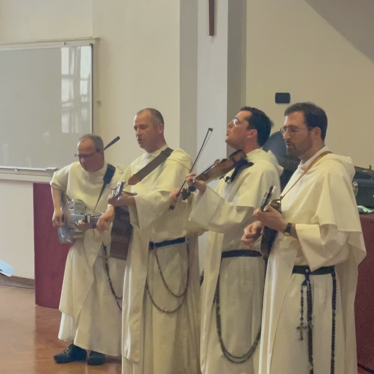 Four Dominican Friars playing musical instruments