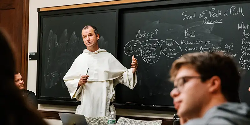 Father Justin Bolger teaching The Soul of Rock and Roll