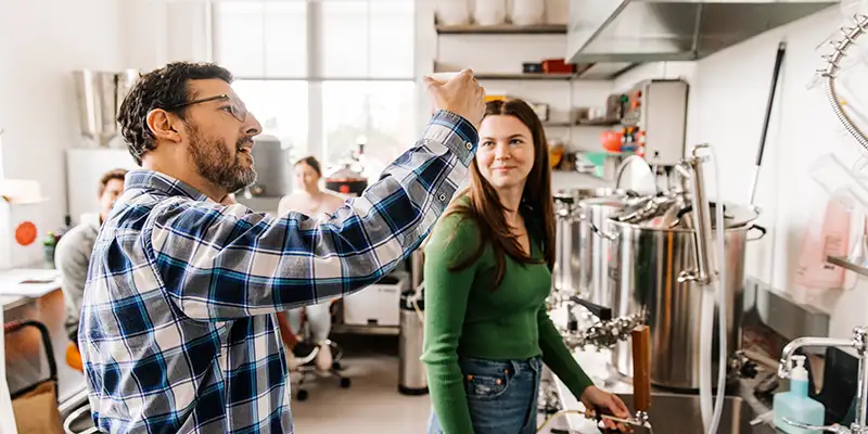 Jay Pike examines a beer in the lab