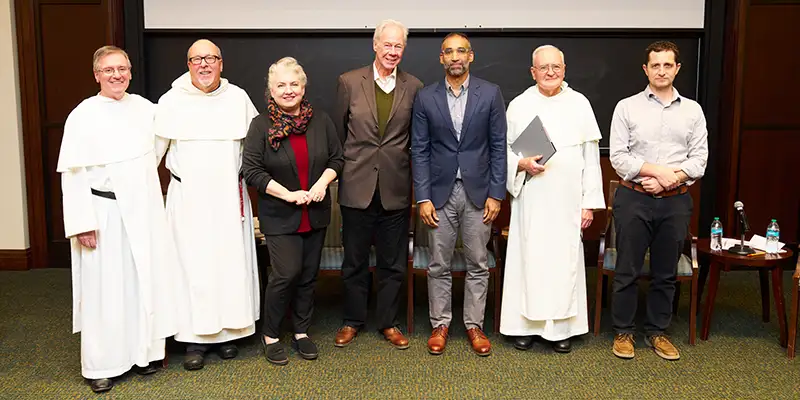 panelists at an event discussing modern sabbath observance with Father Sicard and Father Gumbert