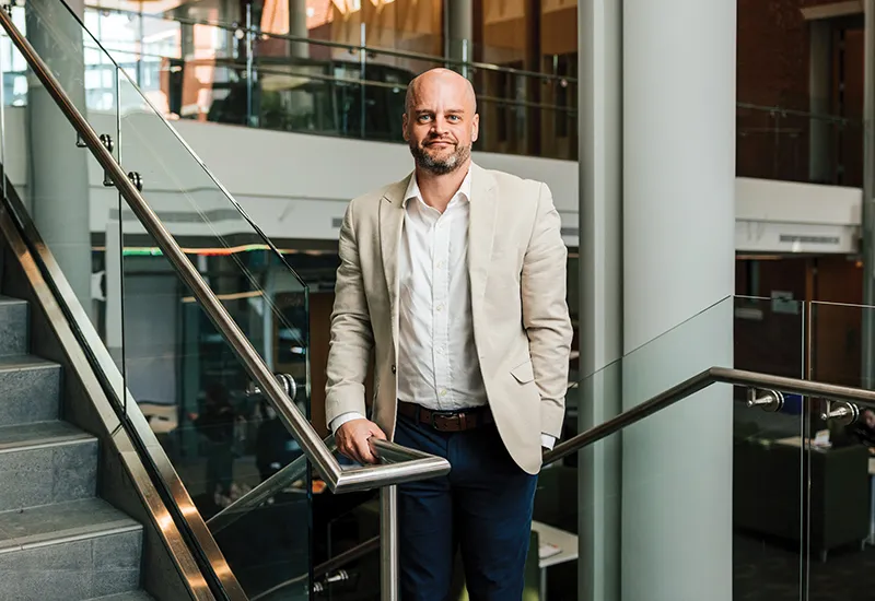 Portrait of Kevin Newman, Ph.D., associate professor of marketing