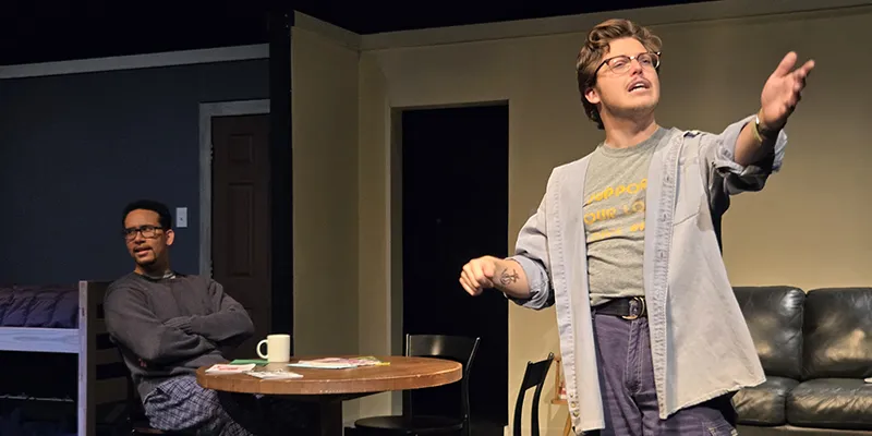 Billing stands and preaches politics to an irritated Thomas seated at the table